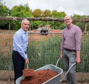 Colin Rankin, Business Development Director for VINCI Construction UK Limited, left and Councillor Richard Beacham, Cabinet Member for Inclusive Growth, Economy and Regeneration at the painted dogs enclosure.